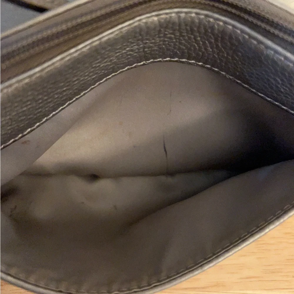 Coach metallic leather wristlet clutch purse.